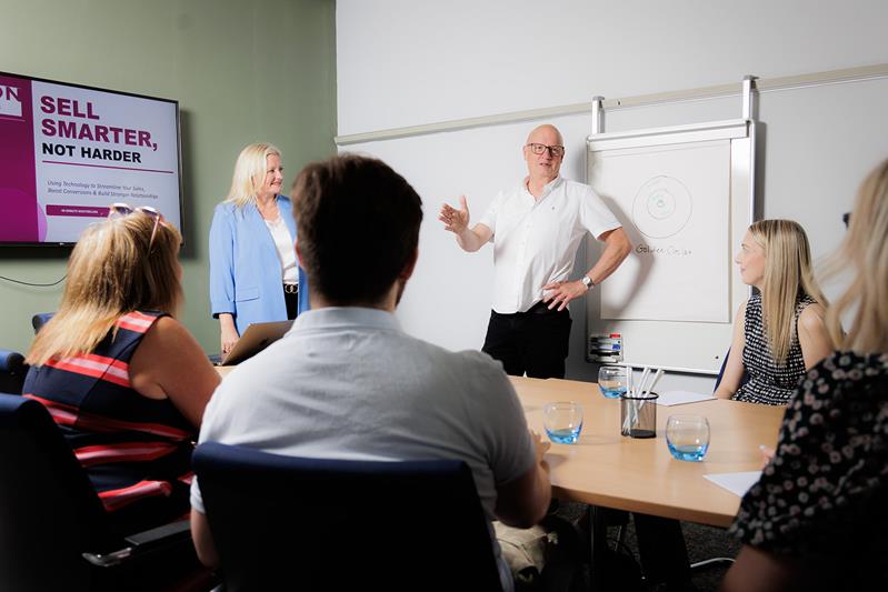 A sales training session in progress, building confidence and technique