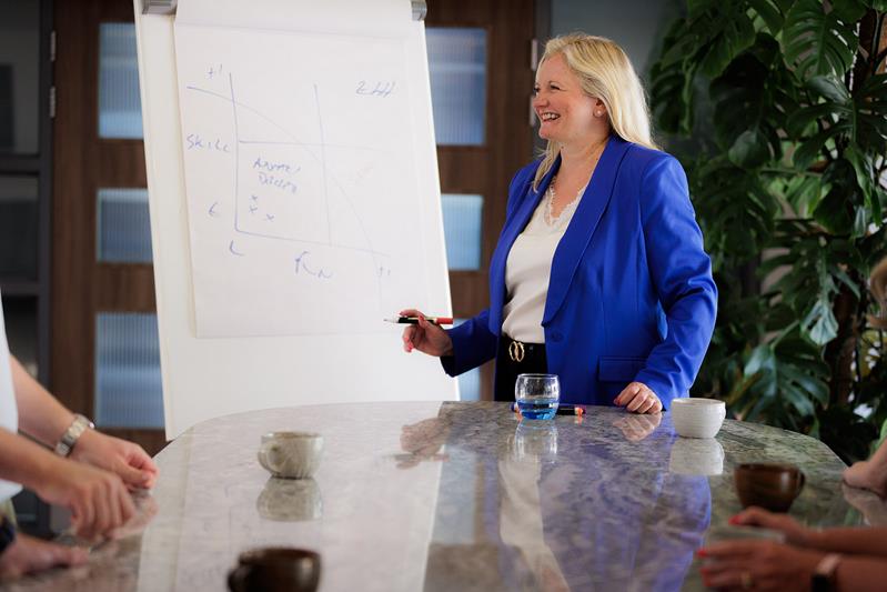 A warm, one to one coaching conversation over coffee
